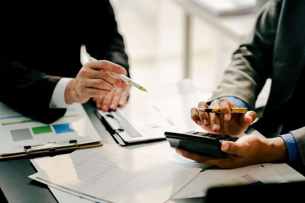 financiers calculating personal taxes for individuals wanting to reduce Income Tax Germany
