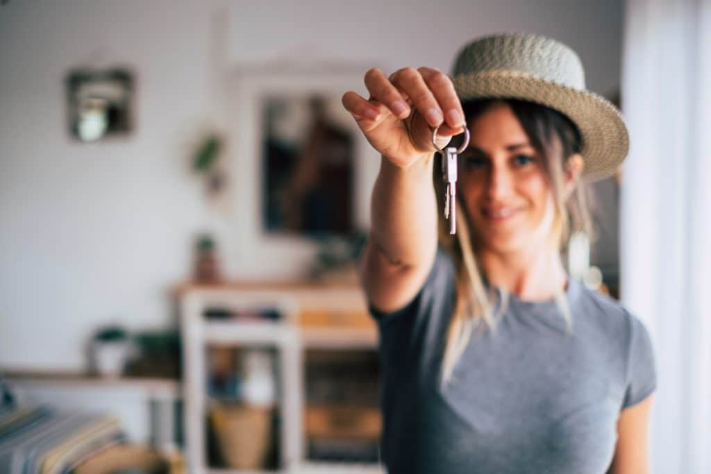 Crop close up of happy woman owner after purchasing home, relocate rent or buy, ownership concept